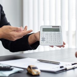 Car dealers or managers have offered special prices and conditions for car purchases with insurance. Service and offering or financial banking concept.